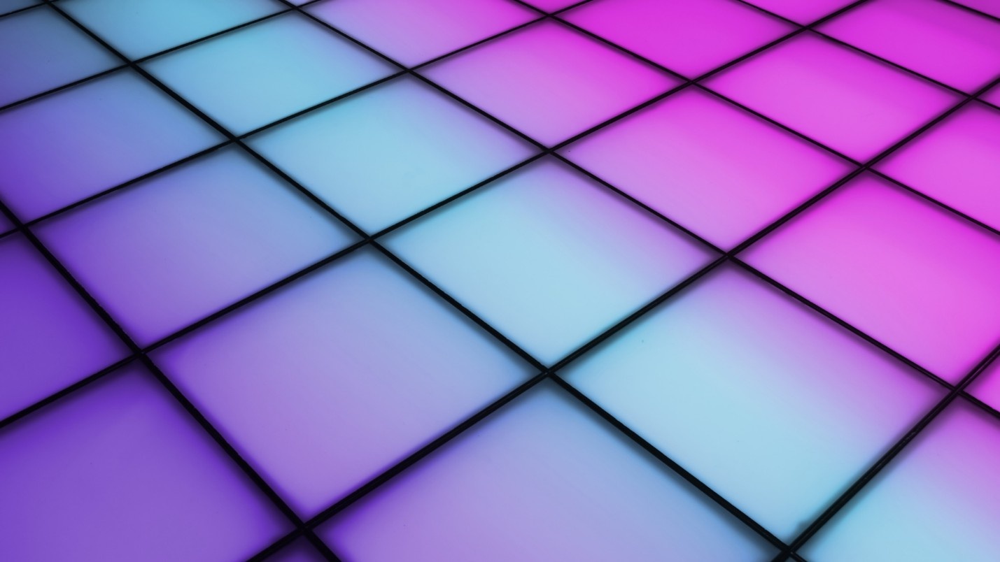 A dance floor illuminated with purple, blue, and pink lights.